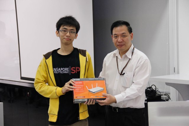 New ISACA Student Member, lucky draw grand winner as well as event photographer Dixon Soo with Mr Yeow